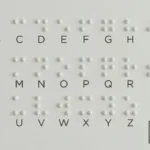 Braille alphabet chart featuring tactile raised dots corresponding to letters A through Z, with the Disable Persons Health Organization (DP-HO) logo in the bottom right corner educational resource for visual impairment and tactile literacy.