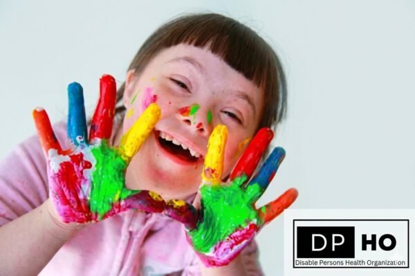 A joyful child with Down Syndrome displaying colorful paint on their hands, representing the inclusive rights and educational support for special needs in Georgia. The Disable Persons Health Organization (DP HO) logo is visible in the bottom right corner.