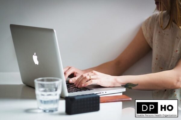 Disable Persons Health Organization logo and a person using a laptop for digital transformation in special education.