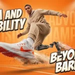 An action-packed, energetic infographic banner titled "YOGA AND DISABILITY" and "BEYOND BARRIERS." The image captures an athletic young man in a tan tracksuit performing a dynamic, high-flying leap across a bright orange studio court background. His right foot, wearing a prominent white and orange Nike running sneaker, thrusts toward the foreground, while his left leg utilizes a high-performance running blade prosthetic that leaves a trail of dust and stylized gold lines mixed with tiny accessibility icons. In the blurry background on the left, a small group of people stands watching, while a simple four-hands-joined unity icon rests next to the "BEYOND BARRIERS" text on the right.